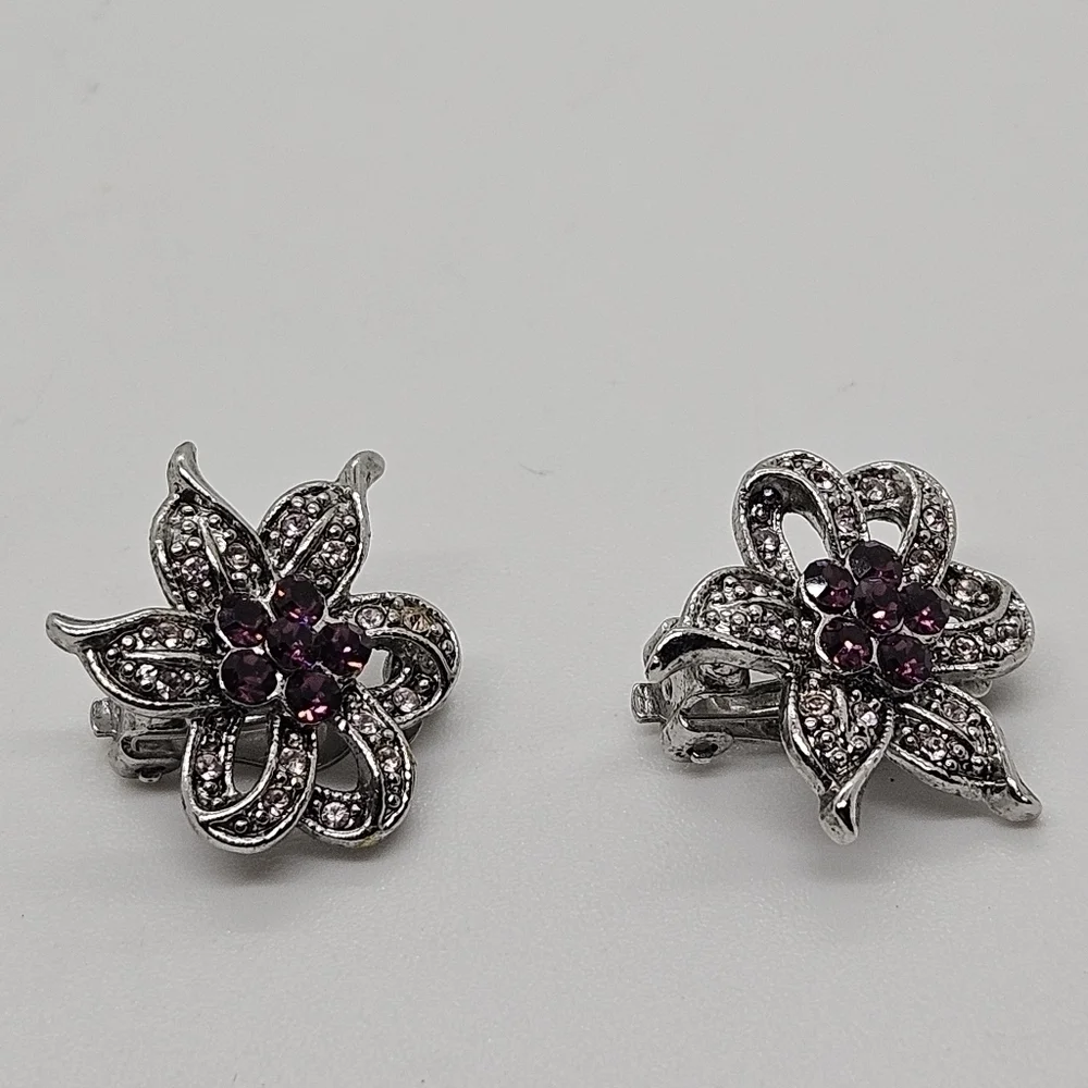 silver tone and purple rhinestone flower clip earrings